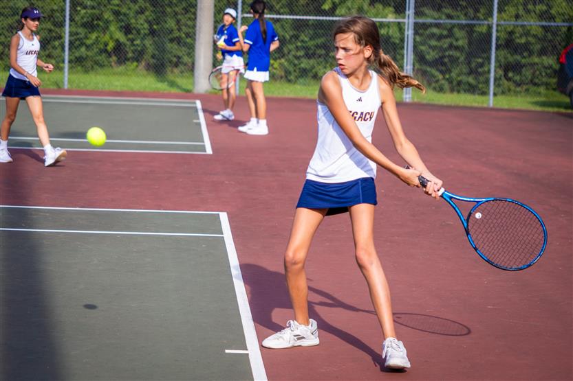 Students play tennis